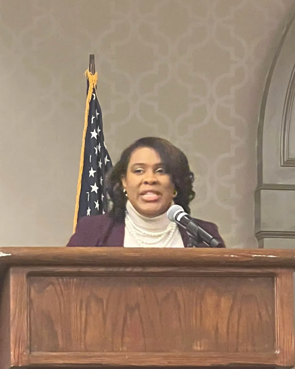 Ashley Eady Smith speaking at a podium
